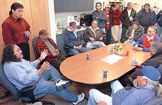 Northern Cheyenne tribal members listen as councilman William Walks Along, seated left, discusses issues with tribal chiefs and council members Thursday night. Standing, left, is Eugene Little Coyote, who has spearheaded a drive to remove Tribal President Geri Small, below.