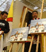 Premier Okalik (center) unveils the Jordin Tootoo poster Tuesday in Iqaluit
